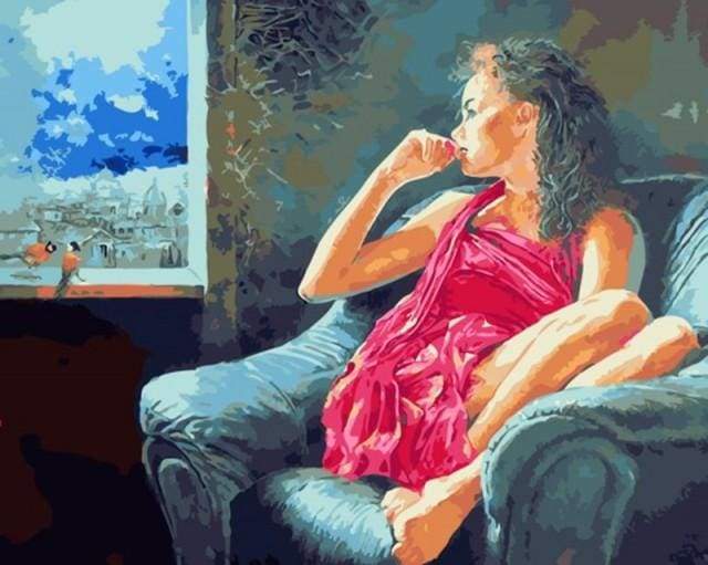 Pensive woman near the window